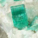 Beryl (variety emerald), Calcite, Pyrite<br />Chivor mining district, El Oriente Mine, Municipio Chivor, Eastern Emerald Belt, Boyacá Department, Colombia<br />59x50x33mm, xl=8mm<br /> (Author: Fiebre Verde)