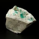 Beryl (variety emerald), Calcite, Pyrite<br />Chivor mining district, El Oriente Mine, Municipio Chivor, Eastern Emerald Belt, Boyacá Department, Colombia<br />59x50x33mm, xl=8mm<br /> (Author: Fiebre Verde)