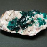 Dioptase on CalciteTsumeb Mine, Tsumeb, Otjikoto Region, Namibia60mm x 29mm x 25mm (Author: Heimo Hellwig)