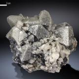 Scheelite, Calcite, Helvine<br />Huanggang Mines, Hexigten Banner (Kèshíkèténg Qí), Chifeng (Ulanhad), Inner Mongolia Autonomous Region, China<br />93 x 67 mm<br /> (Author: Manuel Mesa)