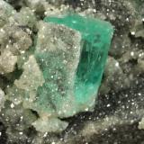 Beryl (variety emerald), Calcite, Pyrite<br />Muzo mining district, Western Emerald Belt, Boyacá Department, Colombia<br />90x45x58mm, main xl=16x11mm<br /> (Author: Fiebre Verde)