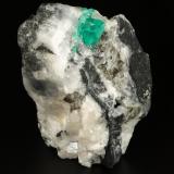 Beryl (variety emerald), Calcite<br />La Pita mining district, Cunas Mine, Municipio Maripí, Western Emerald Belt, Boyacá Department, Colombia<br />43x63x56mm, xl=10x6mm<br /> (Author: Fiebre Verde)