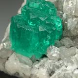 Beryl (variety emerald), Calcite, Dolomite<br />La Pita mining district, Municipio Maripí, Western Emerald Belt, Boyacá Department, Colombia<br />28x36x19mm, aggregate=6x9mm<br /> (Author: Fiebre Verde)