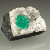 Beryl (variety emerald), Calcite, Dolomite<br />La Pita mining district, Municipio Maripí, Western Emerald Belt, Boyacá Department, Colombia<br />28x36x19mm, aggregate=6x9mm<br /> (Author: Fiebre Verde)