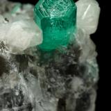 Beryl (variety emerald), Calcite<br />La Pita mining district, Cunas Mine, Municipio Maripí, Western Emerald Belt, Boyacá Department, Colombia<br />37x41x24mm, xl=9mm<br /> (Author: Fiebre Verde)