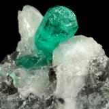 Beryl (variety emerald), Calcite<br />La Pita mining district, Cunas Mine, Municipio Maripí, Western Emerald Belt, Boyacá Department, Colombia<br />37x41x24mm, xl=9mm<br /> (Author: Fiebre Verde)