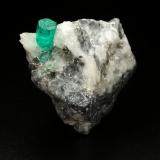 Beryl (variety emerald), Calcite<br />La Pita mining district, Cunas Mine, Municipio Maripí, Western Emerald Belt, Boyacá Department, Colombia<br />37x41x24mm, xl=9mm<br /> (Author: Fiebre Verde)