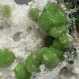 Wavellite on QuartzCanteras Mauldin Mountain, Monte Mauldin, Montgomery County, Arkansas, USAMain ball of crystals: 0.6 × 0.6 cm (Author: Jordi Fabre)