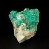 Beryl (variety emerald), Calcite, Quartz<br />Peñas Blancas Mine, Municipio San Pablo de Borbur, Western Emerald Belt, Boyacá Department, Colombia<br />43x30x34mm, aggregate with xls up to 10mm<br /> (Author: Fiebre Verde)