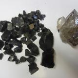 Quartz and anthraxolite<br />Turtle Clan Ridge, Fonda, Mohawk, Montgomery County, New York, USA<br />Quartz is 10cm.<br /> (Author: vic rzonca)