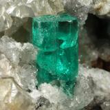 Beryl (variety emerald), Calcite, Dolomite, Pyrite<br />La Pita mining district, Municipio Maripí, Western Emerald Belt, Boyacá Department, Colombia<br />67x53x27mm, xl=11mm<br /> (Author: Fiebre Verde)