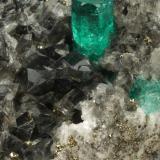 Beryl (variety emerald), Calcite, Dolomite, Pyrite<br />Chivor mining district, El Acuario Mine, Municipio Chivor, Eastern Emerald Belt, Boyacá Department, Colombia<br />84x43x54mm, xl=7mm<br /> (Author: Fiebre Verde)