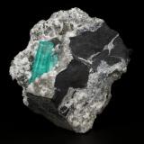 Beryl (variety emerald), Albite (variety cleavelandite), Calcite, Pyrite<br />Chivor mining district, Palo Arañado Mine, Municipio Chivor, Eastern Emerald Belt, Boyacá Department, Colombia<br />55x56x22mm, main aggregate=24mm<br /> (Author: Fiebre Verde)