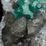 Beryl (variety emerald), Calcite, Dolomite<br />La Pita mining district, Cunas Mine, Municipio Maripí, Western Emerald Belt, Boyacá Department, Colombia<br />33x20x23mm, main aggregate=10x9mm<br /> (Author: Fiebre Verde)