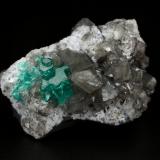 Beryl (variety emerald), Calcite, Dolomite<br />La Pita mining district, Cunas Mine, Municipio Maripí, Western Emerald Belt, Boyacá Department, Colombia<br />33x20x23mm, main aggregate=10x9mm<br /> (Author: Fiebre Verde)