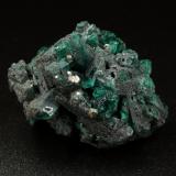 Beryl (variety emerald), Pyrite<br />Coscuez mining district, Municipio San Pablo de Borbur, Western Emerald Belt, Boyacá Department, Colombia<br />37x25x29mm, xls up to 1cm<br /> (Author: Fiebre Verde)