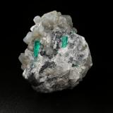 Beryl (variety emerald), Calcite, Dolomite<br />La Pita mining district, Cunas Mine, Municipio Maripí, Western Emerald Belt, Boyacá Department, Colombia<br />47x45x47mm, xl=18mm - 2 xls in the back: 11mm & 7mm<br /> (Author: Fiebre Verde)