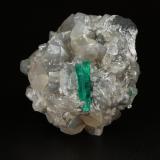 Beryl (variety emerald), Calcite, Dolomite<br />La Pita mining district, Cunas Mine, Municipio Maripí, Western Emerald Belt, Boyacá Department, Colombia<br />47x45x47mm, xl=18mm - 2 xls in the back: 11mm & 7mm<br /> (Author: Fiebre Verde)