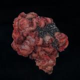 Rhodochrosite, ManganiteZona minera N'Chwaning, Kuruman, Kalahari manganese field (KMF), Provincia Septentrional del Cabo, Sudáfrica5.8 x 4.8 cm (Author: am mizunaka)