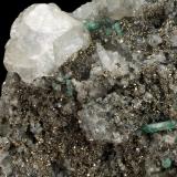 Beryl (variety emerald), Calcite, Pyrite<br />Chivor mining district, Municipio Chivor, Eastern Emerald Belt, Boyacá Department, Colombia<br />89x138x35mm, 15+ xls up to 10mm<br /> (Author: Fiebre Verde)