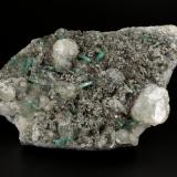 Beryl (variety emerald), Calcite, Pyrite<br />Chivor mining district, Municipio Chivor, Eastern Emerald Belt, Boyacá Department, Colombia<br />89x138x35mm, 15+ xls up to 10mm<br /> (Author: Fiebre Verde)