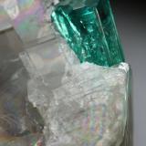 Beryl (variety emerald), Calcite<br />La Pita mining district, Cunas Mine, Municipio Maripí, Western Emerald Belt, Boyacá Department, Colombia<br />33x26x18mm (calcite xl), xls=8.5 & 4mm<br /> (Author: Fiebre Verde)