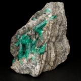Beryl (variety emerald), Calcite, PyriteLa Pita (distrito minero), Municipio Maripí, Cinturón Esmeraldífero Occidental, Departamento Boyacá, Colombia59x40x41mm, largest xl=20mm (Author: Fiebre Verde)