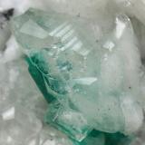 Beryl (variety emerald), Calcite<br />Muzo mining district, Western Emerald Belt, Boyacá Department, Colombia<br />45x47x32mm, xl=15mm<br /> (Author: Fiebre Verde)