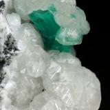 Beryl (variety emerald), Calcite<br />Muzo mining district, Western Emerald Belt, Boyacá Department, Colombia<br />45x47x32mm, xl=15mm<br /> (Author: Fiebre Verde)