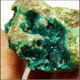 Dioptase and calcite<br />Tsumeb Mine, Tsumeb, Otjikoto Region, Namibia<br />91 x 63 x 36 mm<br /> (Author: Pierre Joubert)