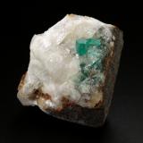 Beryl (variety emerald), Calcite, Quartz<br />Peñas Blancas Mine, Municipio San Pablo de Borbur, Western Emerald Belt, Boyacá Department, Colombia<br />40x44x41mm, xls up to 5mm<br /> (Author: Fiebre Verde)