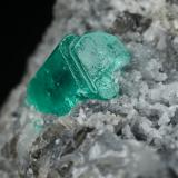 Beryl (variety emerald), Calcite<br />Muzo mining district, Western Emerald Belt, Boyacá Department, Colombia<br />37x19x24mm, xl=9x6mm<br /> (Author: Fiebre Verde)