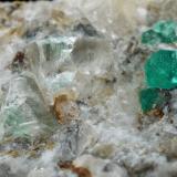 Beryl (variety emerald), Calcite, Quartz, FluoriteMina Peñas Blancas, Municipio San Pablo de Borbur, Cinturón Esmeraldífero Occidental, Departamento Boyacá, Colombia100x61x65mm, main xls=7 &amp; 7mm (Author: Fiebre Verde)