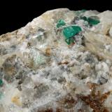 Beryl (variety emerald), Calcite, Quartz, FluoriteMina Peñas Blancas, Municipio San Pablo de Borbur, Cinturón Esmeraldífero Occidental, Departamento Boyacá, Colombia100x61x65mm, main xls=7 &amp; 7mm (Author: Fiebre Verde)