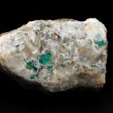 Beryl (variety emerald), Calcite, Quartz, FluoriteMina Peñas Blancas, Municipio San Pablo de Borbur, Cinturón Esmeraldífero Occidental, Departamento Boyacá, Colombia100x61x65mm, main xls=7 &amp; 7mm (Author: Fiebre Verde)