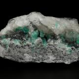 Beryl (variety emerald), Calcite, PyriteCoscuez (distrito minero), Municipio San Pablo de Borbur, Cinturón Esmeraldífero Occidental, Departamento Boyacá, Colombia122x65x48mm, xls up to 8mm (Author: Fiebre Verde)