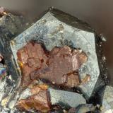 Cassiterite, Hematite<br />Thomas Range, Juab County, Utah, USA<br />FOV = 1.8 mm<br /> (Author: Doug)