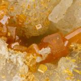 Wulfenite, Vanadinite<br />Shelby Mine, White Hills, Cerbat Mountains, Gold Basin District, Mohave County, Arizona, USA<br />FOV = 2.1 mm<br /> (Author: Doug)