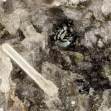 Fluorapatite, Hematite<br />Summit Rock, Klamath County, Oregon, USA<br />FOV = 2.3 mm<br /> (Author: Doug)