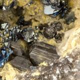 Hematite, Aegirine, Enstatite<br />Summit Rock, Klamath County, Oregon, USA<br />FOV = 2.7 mm<br /> (Author: Doug)