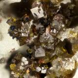 Pharmacosiderite, Carminite<br />Georgine Mine, Candelaria District, Mineral County, Nevada, USA<br />FOV = 1.3 mm<br /> (Author: Doug)