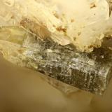Gadolinite-(Y)<br />Washington Pass, Golden Horn Batholith, Okanogan County, Washington, USA<br />FOV = 2.0 mm<br /> (Author: Doug)