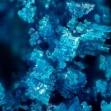 Langite<br />Mountain Mine, Castletown-Bearhaven Copper Mines, Allihies, Beara Peninsula, Kilnamanagh, County Cork, Munster Province, Ireland<br />FOV = 1.6 mm<br /> (Author: Doug)