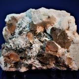 Topaz, Quartz (variety smoky quartz),  Albite (variety cleavelandite), Feldspar, Hematite<br />Shengus (Shingus), Roundu District, Gilgit-Baltistan (Northern Areas), Pakistan<br />200 mm x 150 mm x 95 mm<br /> (Author: Don Lum)