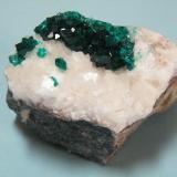 Dioptase on Calcite<br />Tsumeb Mine, Tsumeb, Otjikoto Region, Namibia<br />49mm x 37mm x 45mm<br /> (Author: Heimo Hellwig)