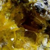 WulfenitaMina El Centenillo, Cortijo del Humo, Cerro de las Minas, Albuñuelas, Comarca Valle de Lecrín, Granada, Andalucía, EspañaCristal mayor 2 mm (Autor: Jorgina-Agusti-Màrius)