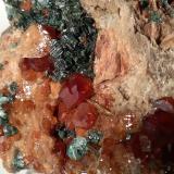 Grossular (variety hessonite), Vesuvianite, ClinochloreFalin Lake, Usseglio, Val di Viù / Viù Valley, Lanzo Valleys (Valli di Lanzo), Metropolitan City of Turin Province, Piedmont (Piemonte), Italy68 x 65mm (Author: Sante Celiberti)