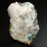 Beryl (variety emerald), Calcite, Fluorite<br />Peñas Blancas Mine, Municipio San Pablo de Borbur, Western Emerald Belt, Boyacá Department, Colombia<br />36mm x 17mm x 26mm, xl=6mm<br /> (Author: Fiebre Verde)