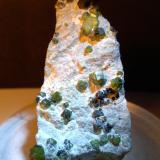 Andradite (variety demantoid), Asbestos<br />Sferlùn asbestos Mine, Vallone del Cengiaccio, Lanzada, Malenco Valley (Valmalenco), Sondrio Province, Lombardy, Italy<br />44 x 52 mm<br /> (Author: Sante Celiberti)