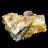 Monazita-(Ce) y Uraninita<br />Sierra Albarrana, Hornachuelos, Comarca Valle Medio del Guadalquivir, Córdoba, Andalucía, España<br />Cristal de 7 mm de monzita en pegmatita de 24x22x15 mm<br /> (Autor: Antonio Carmona)